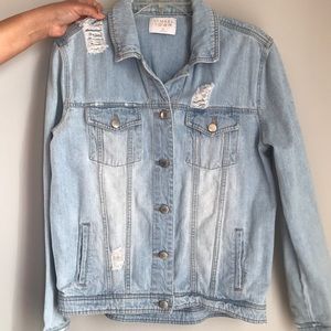 Jean ripped Jacket that says love on the back